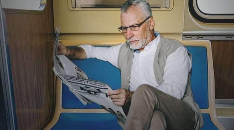 Sad Sack On Bus Reading Actual Newspaper Like It’s 1922 Or Some Shit